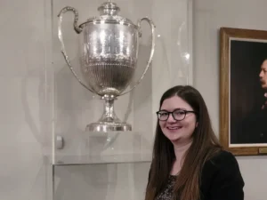 Conway Tennis Club, 2022: Also at the awards night, Emma Harverson stands next to the Queen’s Club Tennis trophy.